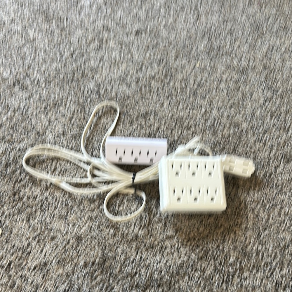 Extension cord with 2 electrical plug adaptor.